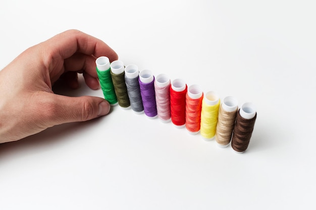 Hands stitching colorful embroidery